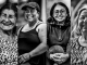 Mujeres voceadoras de QHUBO